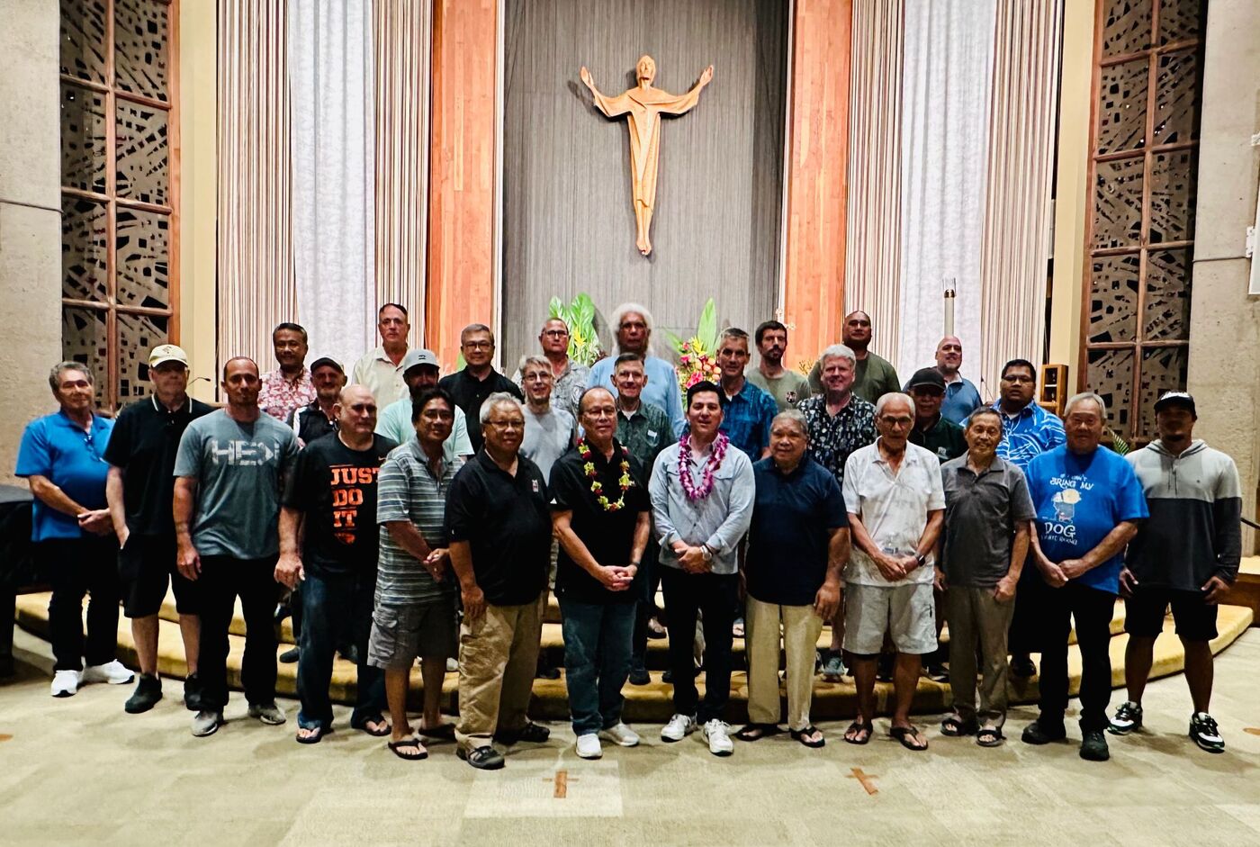 About thirty men of the fellowship gathered before the altar beneath a carved figure of the risen Christ